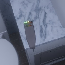 Phasmophobia EMF Reader at Level 3 Phasmophobia EMF reader with 2 green leds and 1 yellow lit on the counter of the bathroom