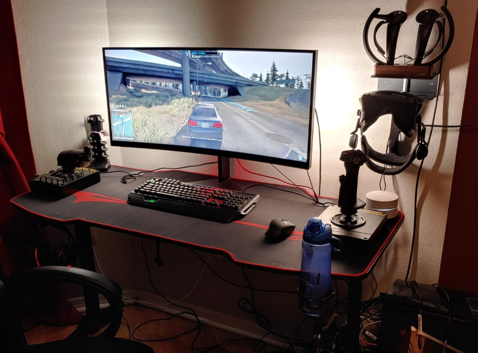 Gamer desk with Alienware Monitor, HOTAS, keyboard, mouse and Valve Index Headset