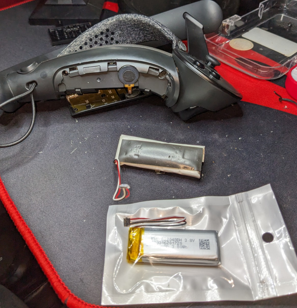 Replacing Valve Index Controller Battery Disassembled Valve Index Controller with old and replacement battery